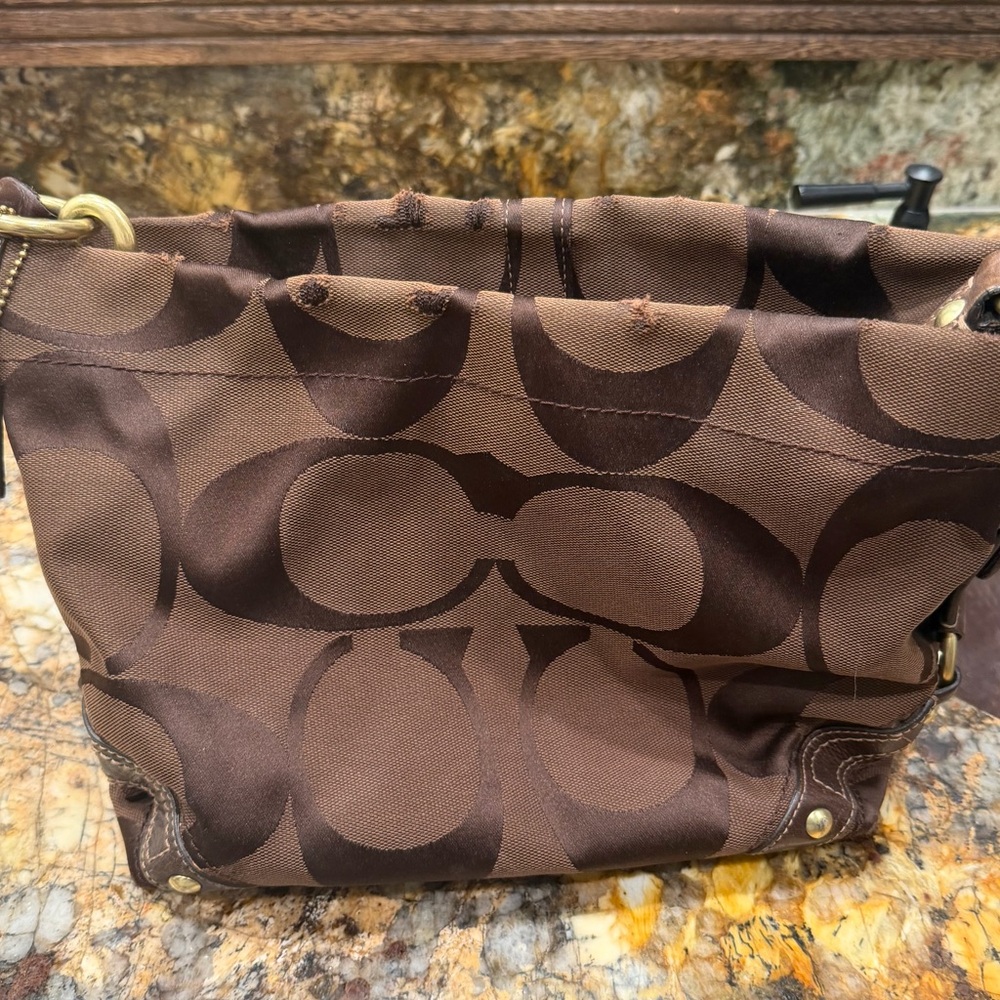 Coach Dark Brown Signature
Canvas Leather Carly Hobo
Shoulder Bag